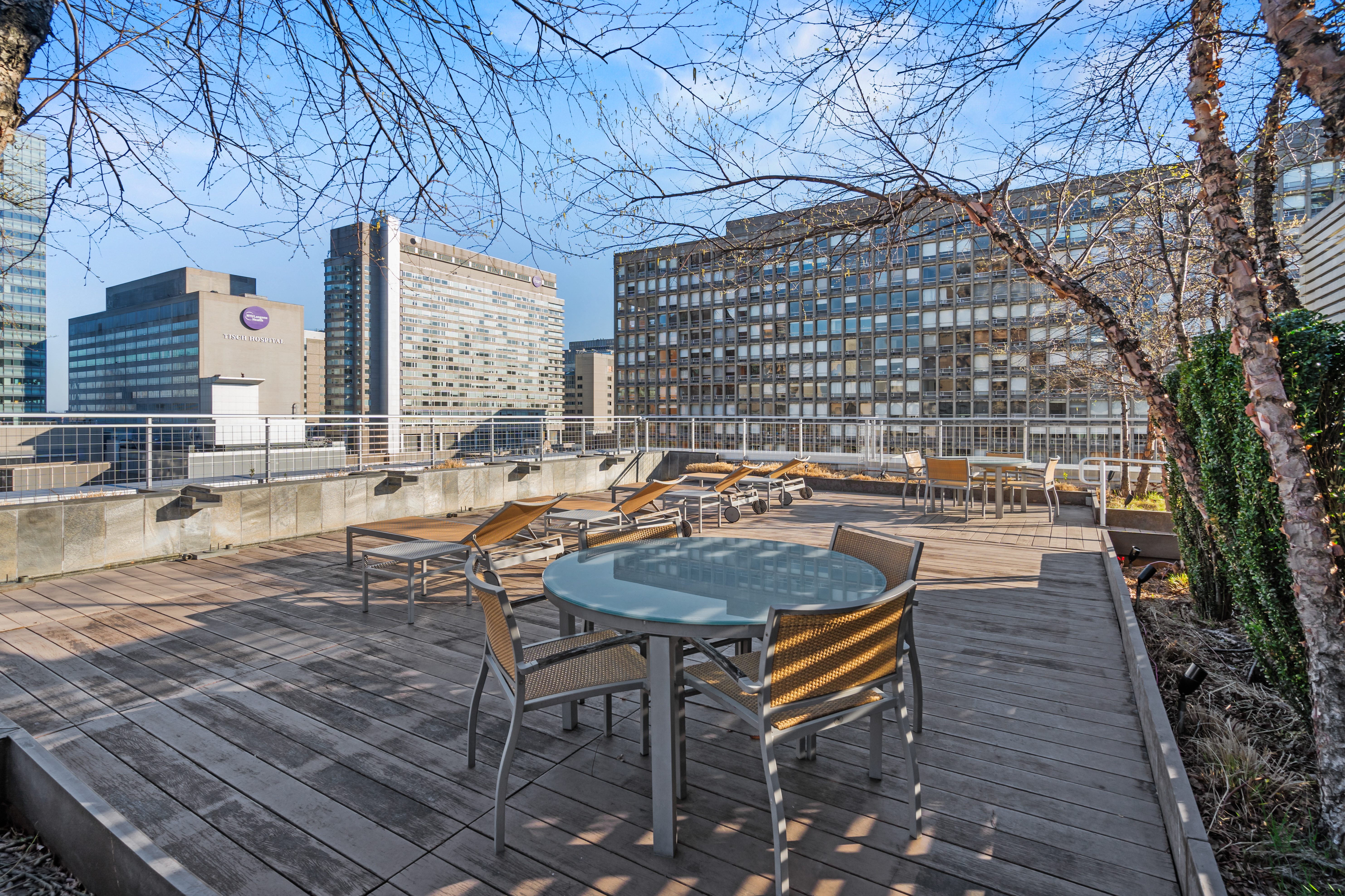 303 East 33rd Street, Unit 5H Manhattan, NY 10016 - Photo 14 of 18 a backyard of a house with outdoor seating