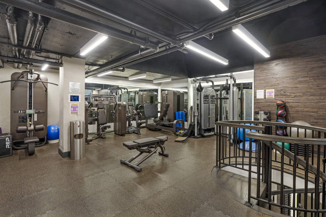 167 East 61st Street, Unit 21B Manhattan, NY 10065 - Photo 9 of 12 a view of a room with gym equipment