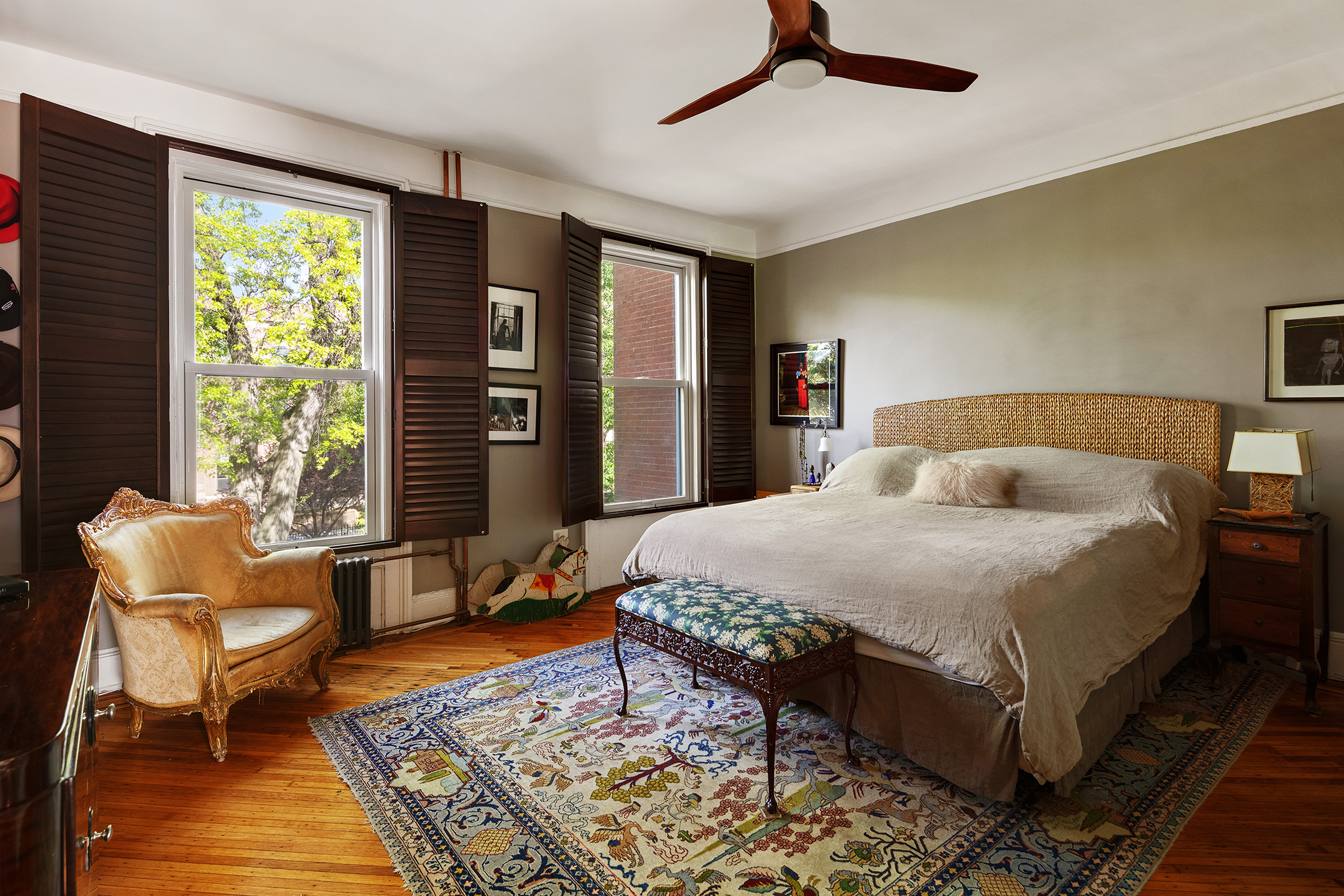 264 Clinton Avenue Brooklyn, NY 11205 - Photo 8 of 21 a bedroom with a bed and wooden floor