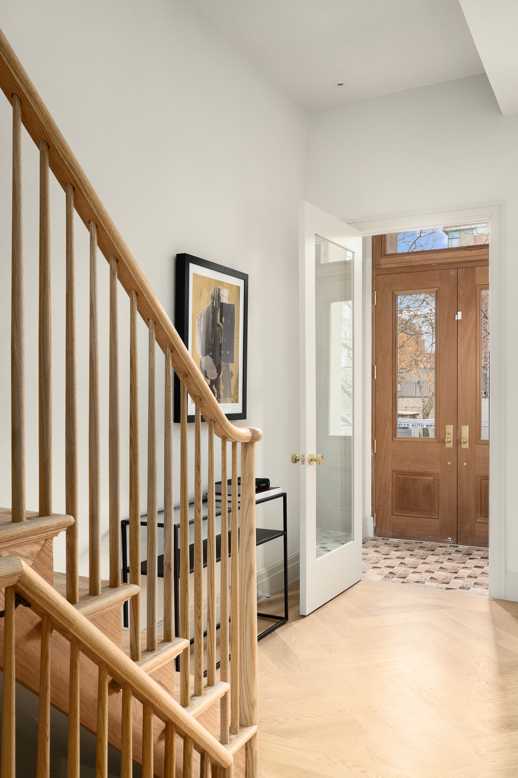 167 Quincy Street Brooklyn, NY 11216 - Photo 7 of 20 a view of an entryway with wooden floor and door