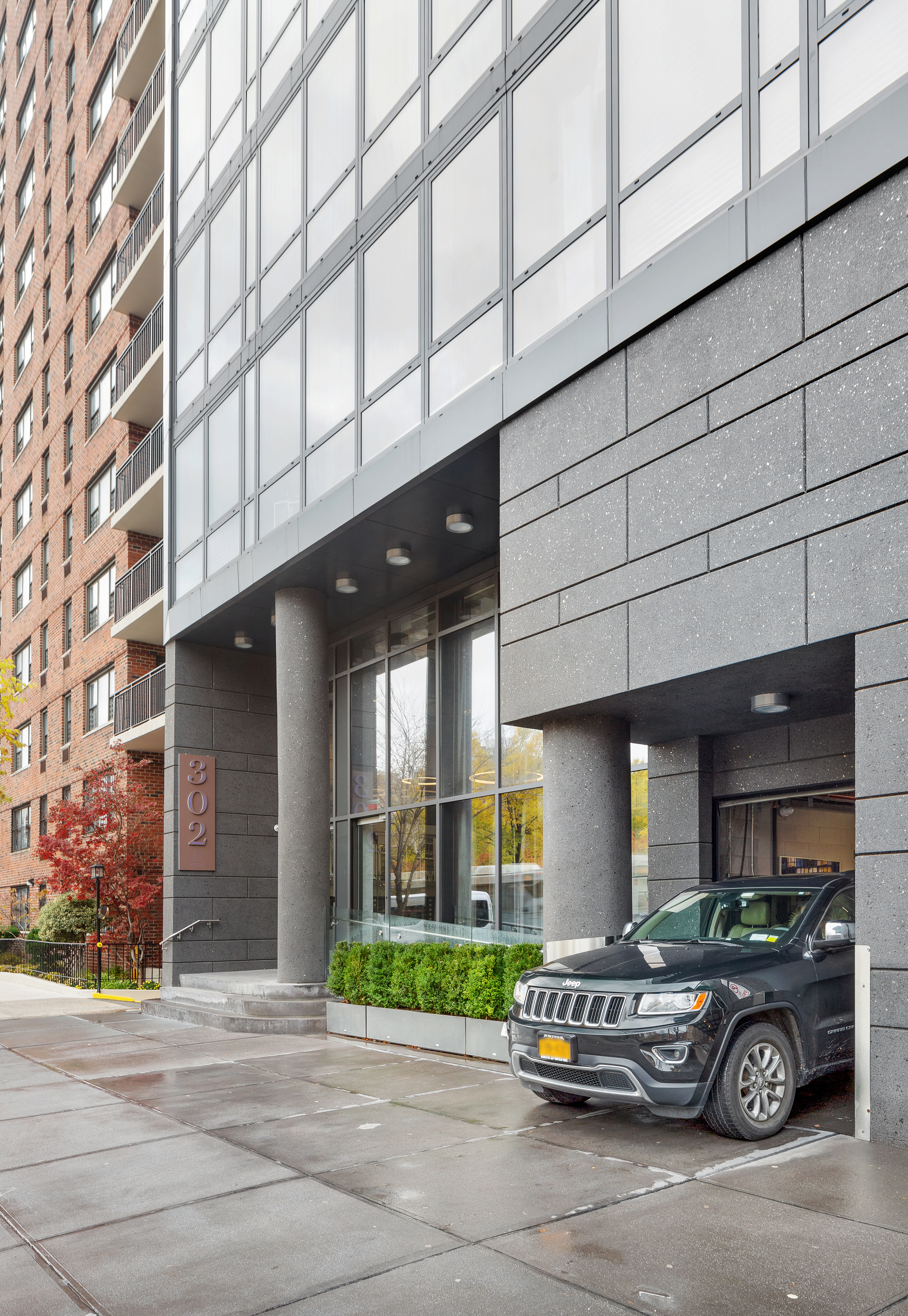 302 East 96th Street, Unit PH6 Manhattan, NY 10128 - Photo 11 of 13 a car parked in front of a building