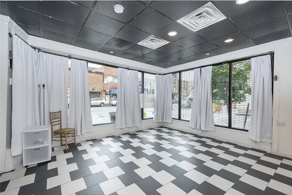a view of a livingroom with a black and white checkered floor