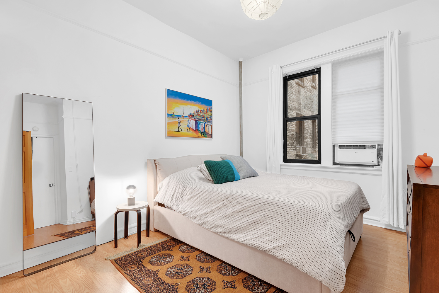 166 East 92nd Street, Unit 1D Manhattan, NY 10128 - Photo 4 of 6 a bedroom with a bed and a window