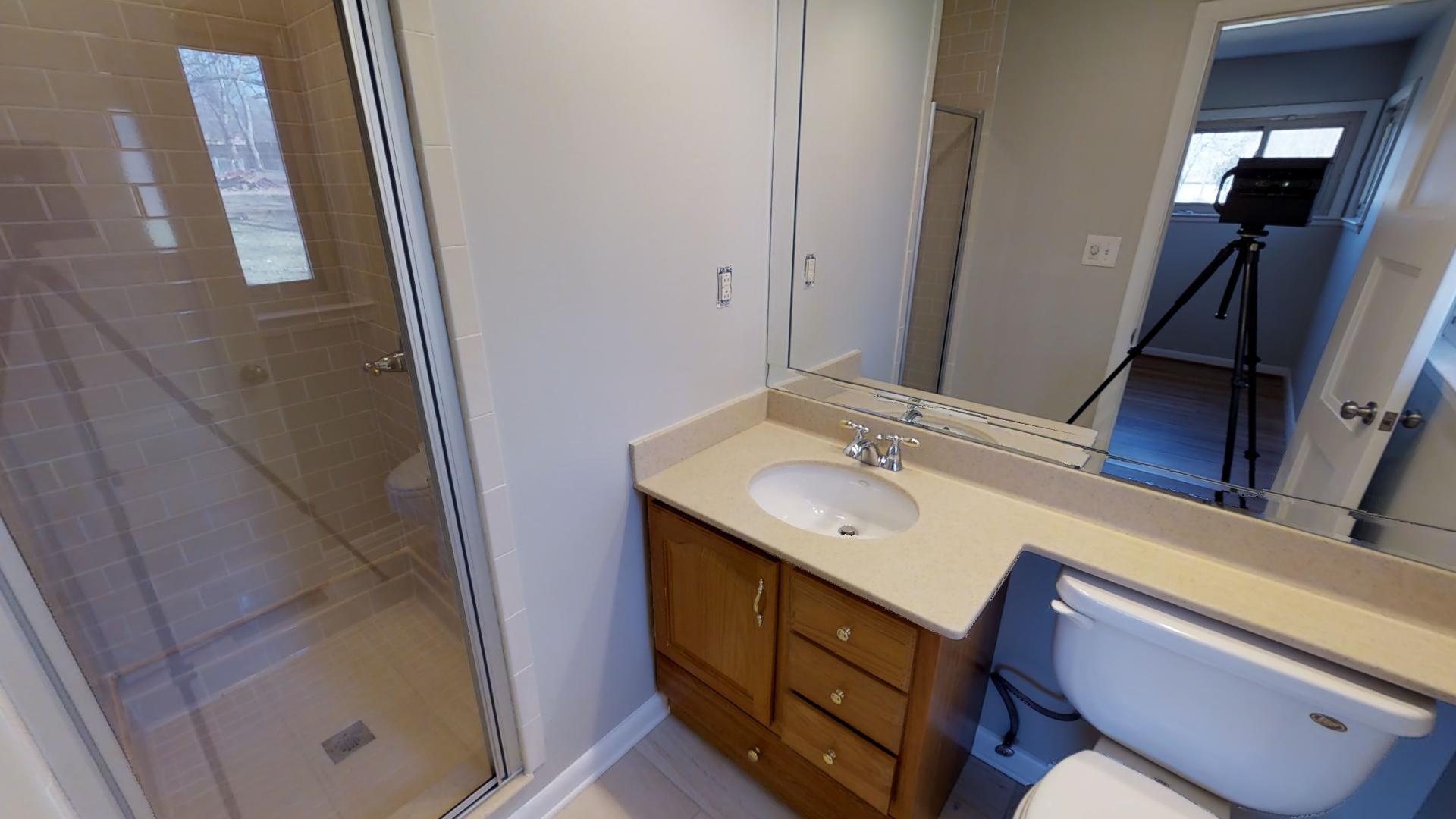 4425 Prescott Road Nashville, TN 37204 - Photo 22 of 26 a bathroom with a sink a mirror and a toilet