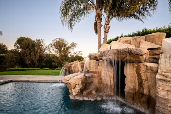 an aerial view of a house with an outdoor space