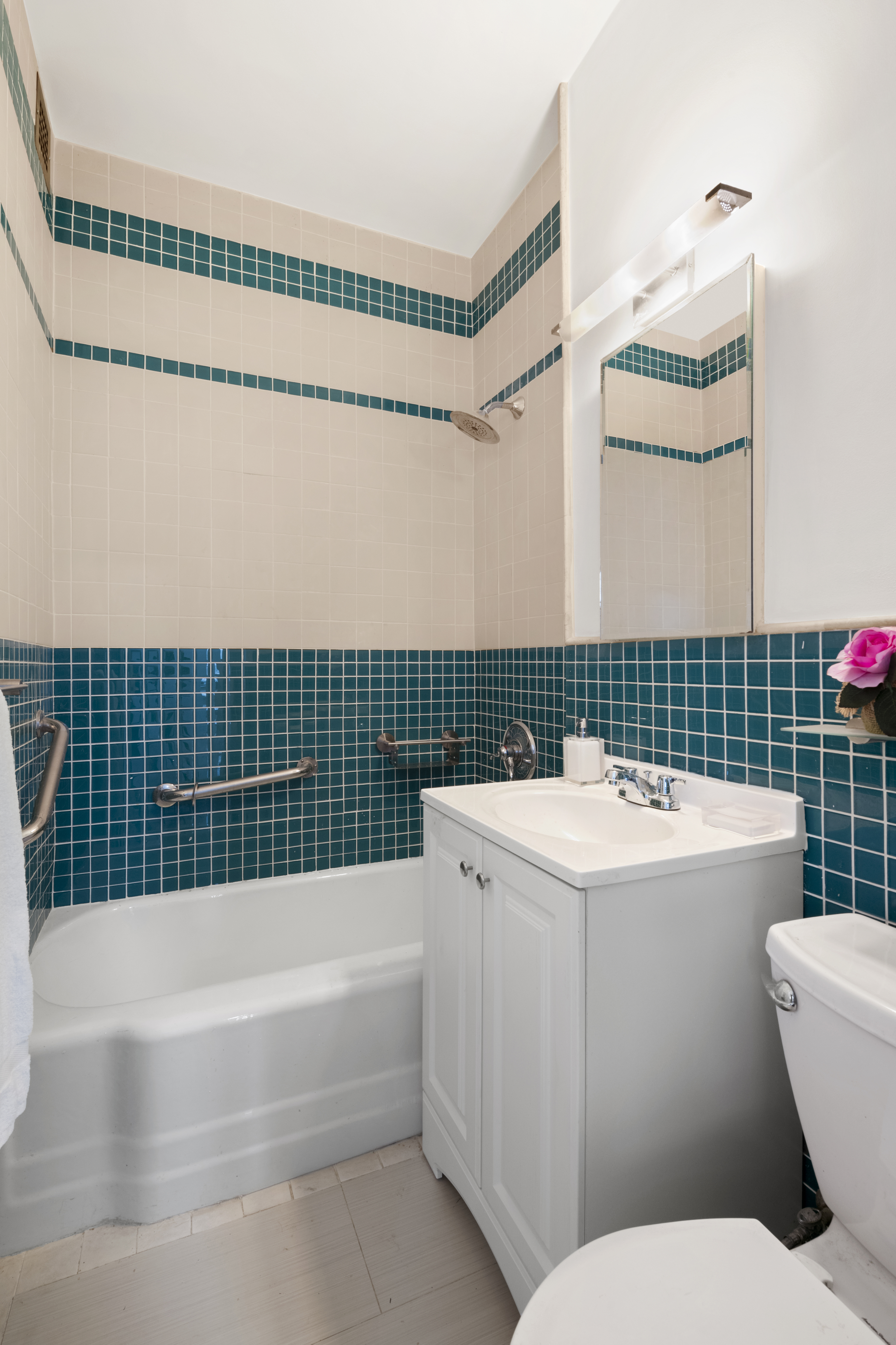 201 East 21st Street, Unit 15C Manhattan, NY 10010 - Photo 7 of 9 a view of bathroom with a sink toilet and shower