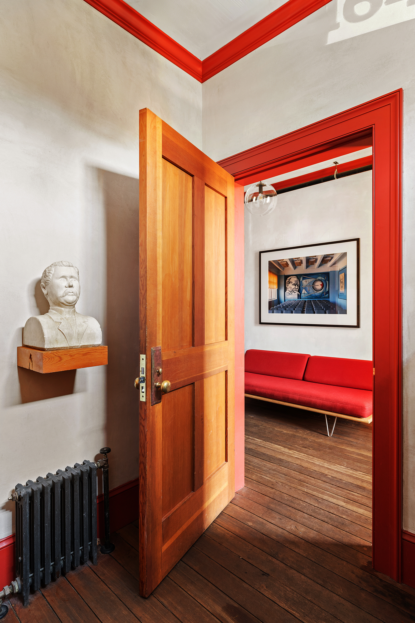 164 Coffey Street Brooklyn, NY 11231 - Photo 20 of 31 a room with red door and wooden floor