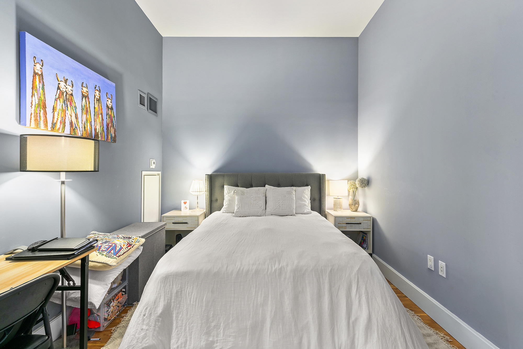 360 Furman Street, Unit 616 Brooklyn, NY 11201 - Photo 3 of 6 a bedroom with a bed and a lamp on dresser