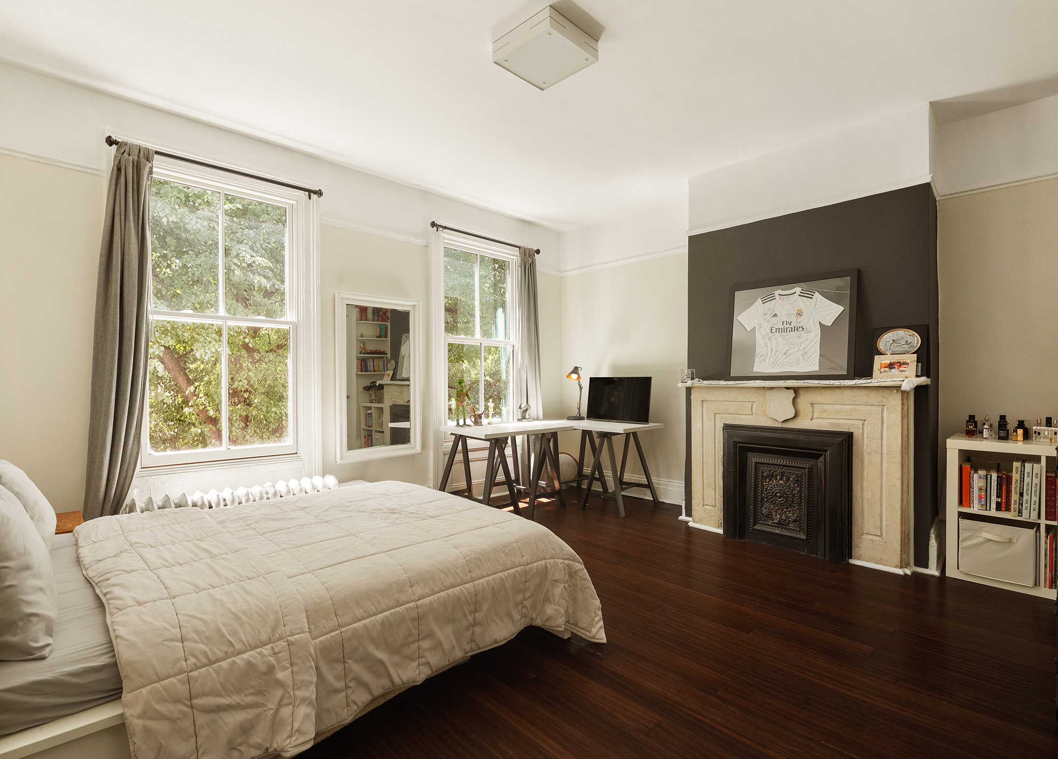 123 Cambridge Place Brooklyn, NY 11238 - Photo 14 of 22 a bedroom with a bed and a fireplace