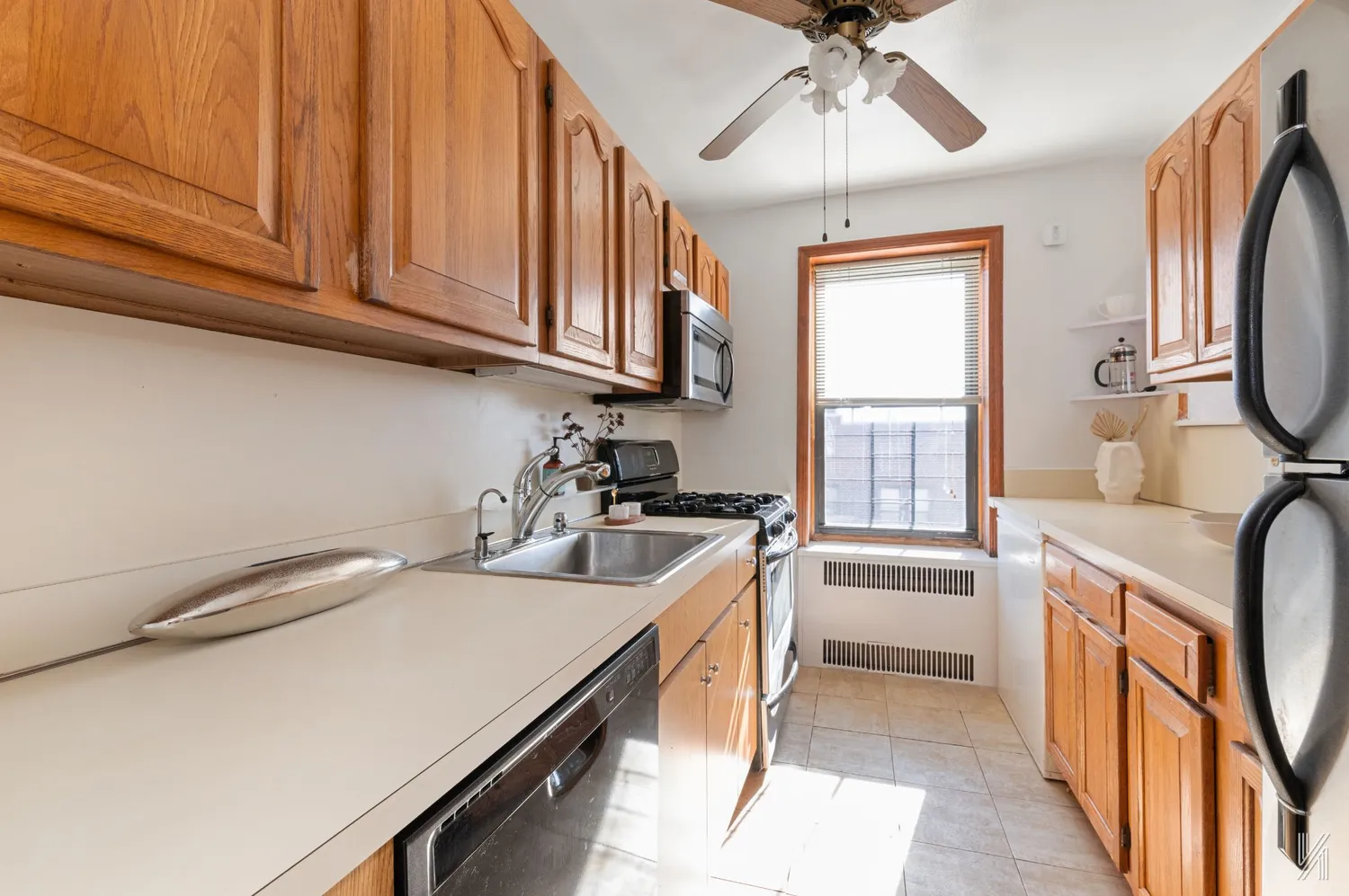 a kitchen that has a sink and a stove