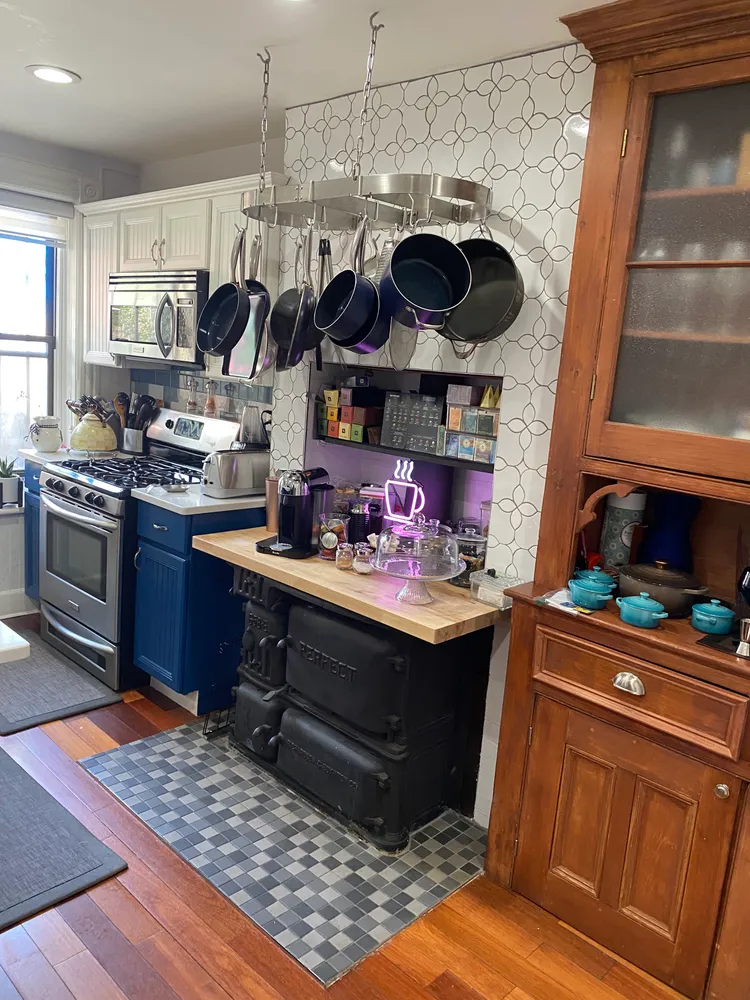 a kitchen with stainless steel appliances granite countertop a sink dishwasher stove and cabinets