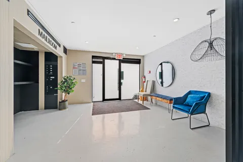 a view of a livingroom with furniture and entryway