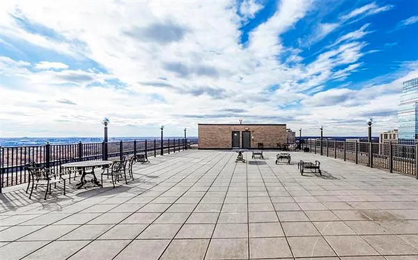 a view of roof deck with seating space
