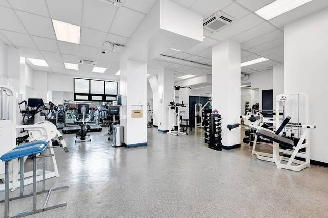 870 United Nations Plaza, Unit 14F Manhattan, NY 10017 - Photo 14 of 16 a view of a room with gym equipment