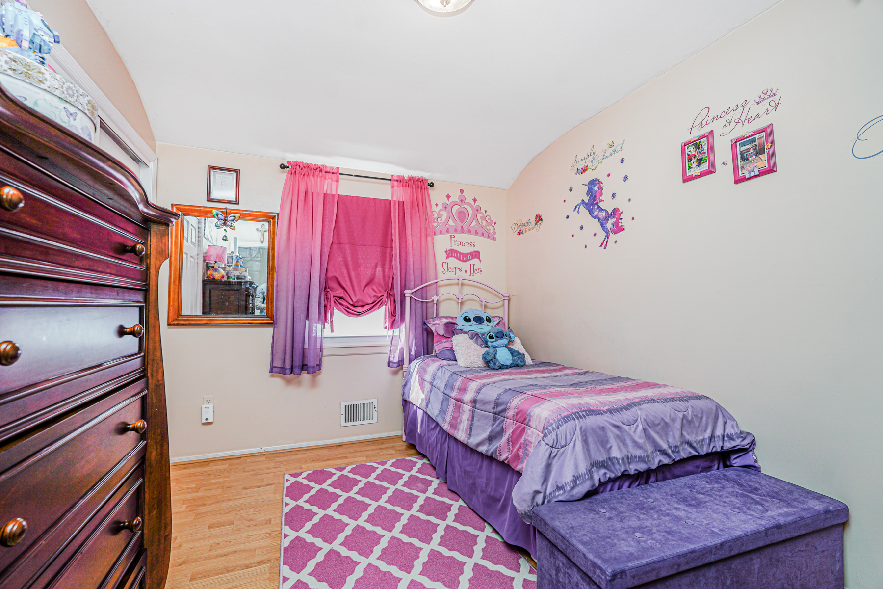 287 Greaves Avenue Staten Island, NY 10308 - Photo 19 of 35 a bedroom with a bed and a couch