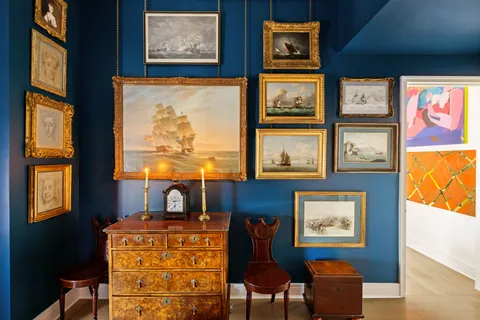 a front view of a livingroom with furniture and window