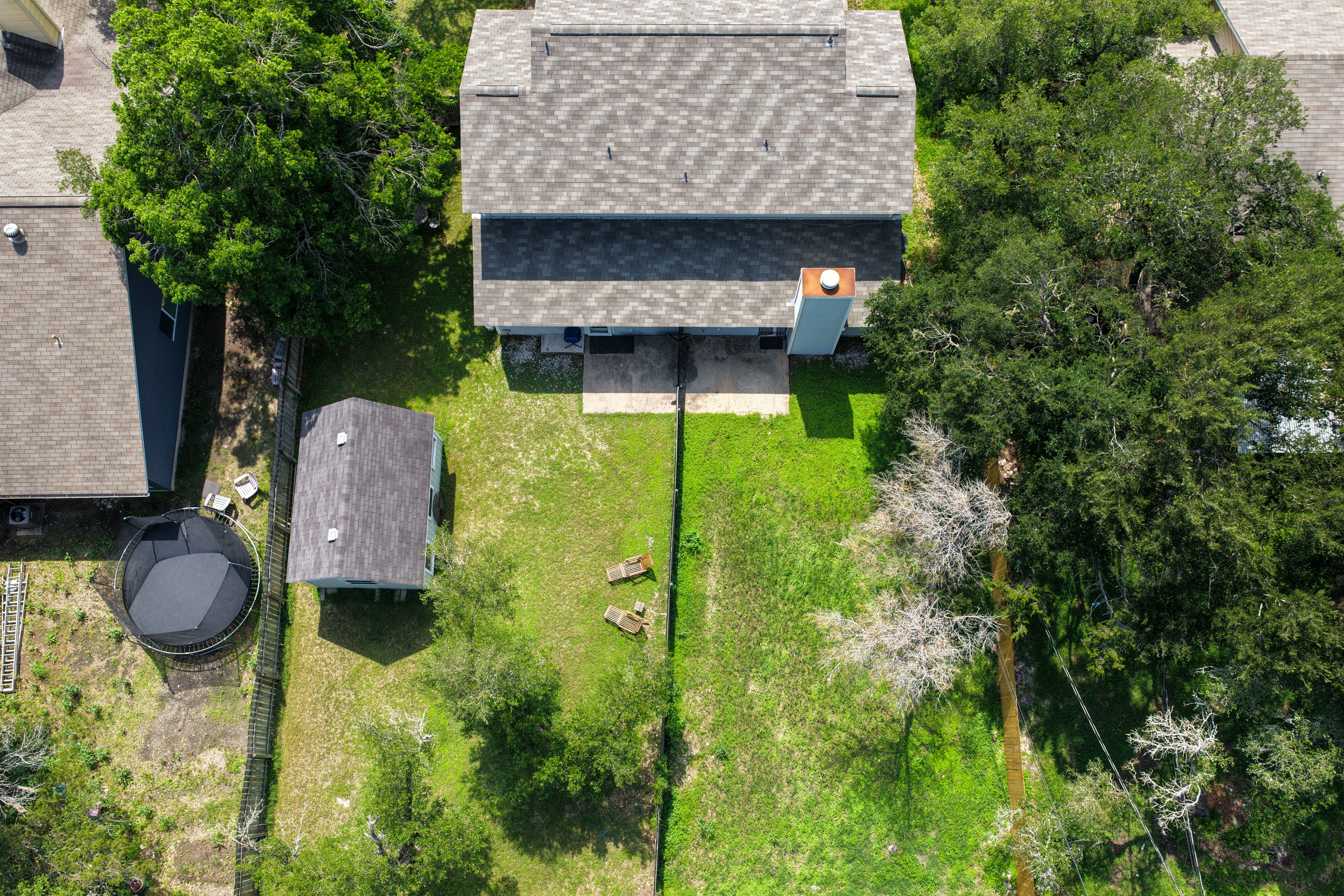 8710 Clearbrook Trail Austin, TX 78729 - Photo 27 of 28 a backyard of a house with table and chairs