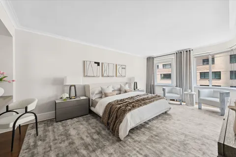 a bed room with a bed and furniture