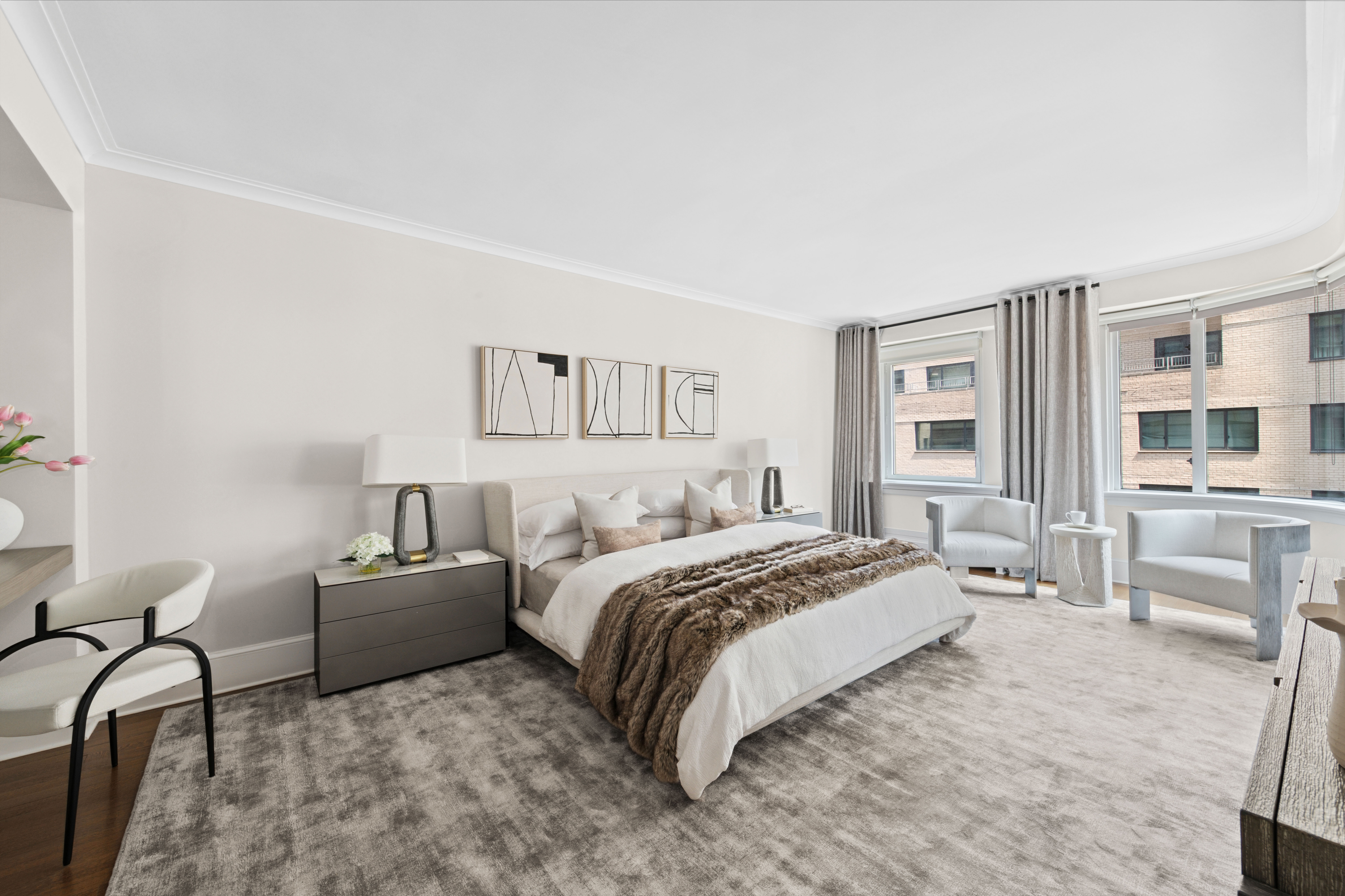 530 Park Avenue, Unit 12F Manhattan, NY 10065 - Photo 9 of 26 a bed room with a bed and furniture