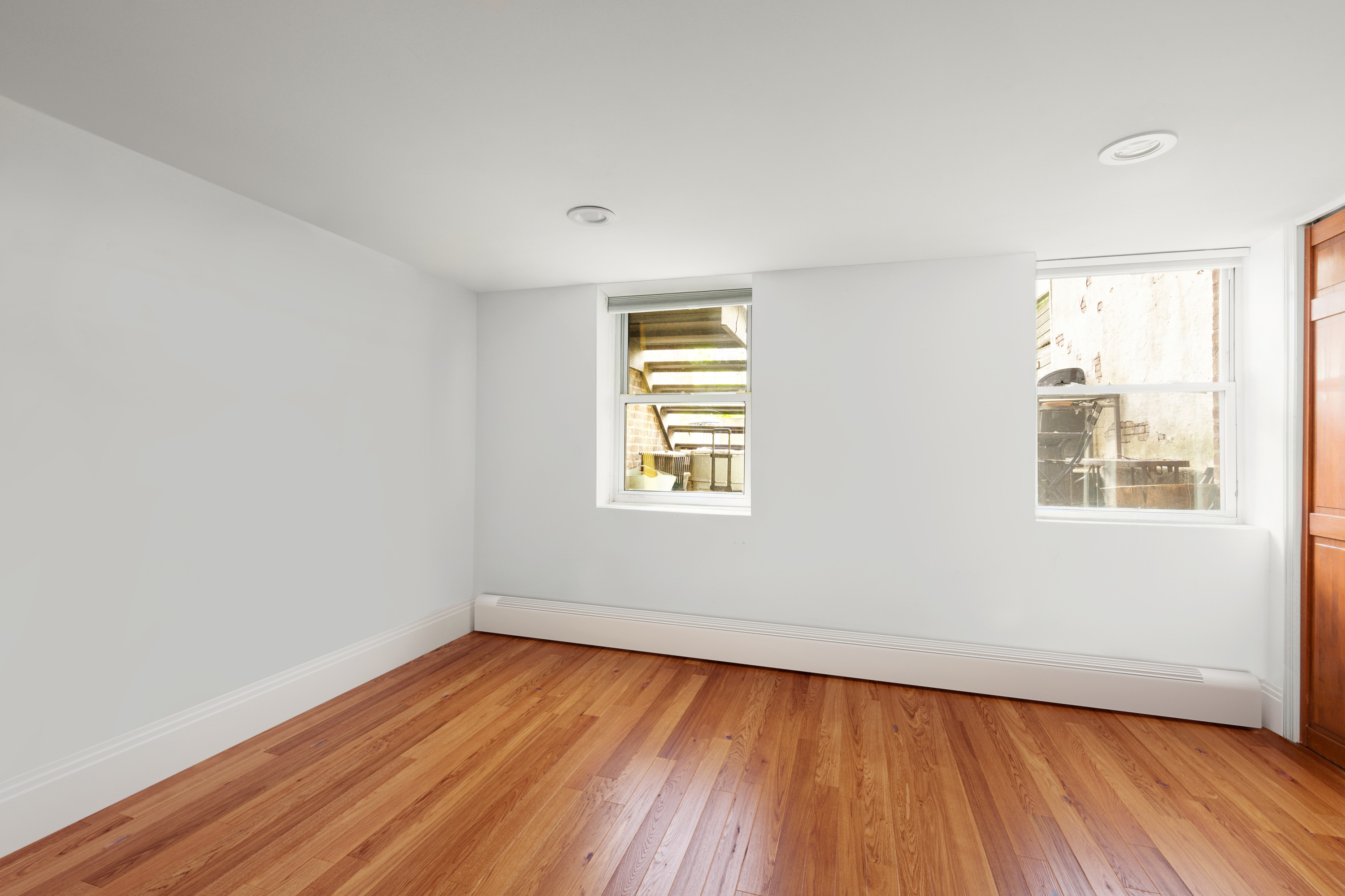 38 Douglass Street Brooklyn, NY 11231 - Photo 10 of 20 an empty room with wooden floor and windows