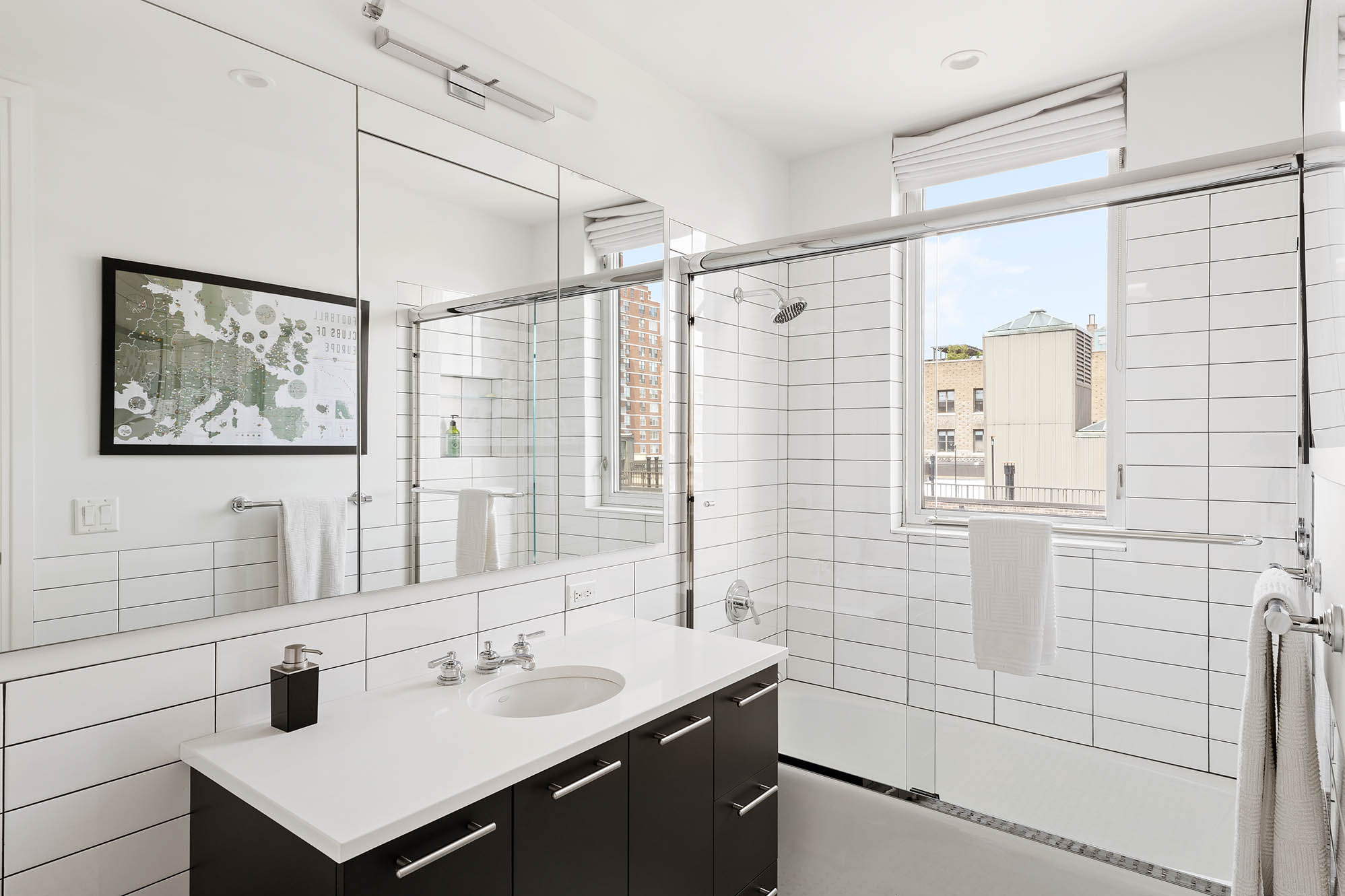 545 West 110th Street, Unit PH11A Manhattan, NY 10025 - Photo 20 of 22 a bathroom with a sink and a mirror