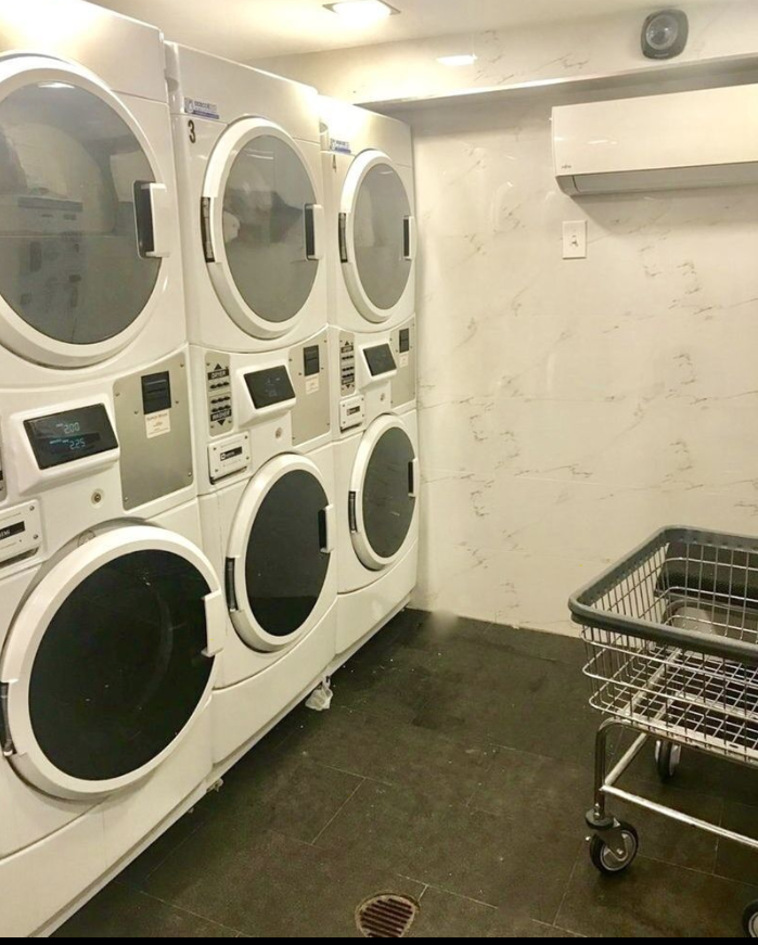 1773 1st Avenue, Unit 18 Manhattan, NY 10128 - Photo 8 of 10 a utility room with dryer and washer