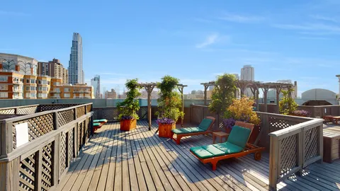 a view of a balcony with wooden floor and outdoor seating