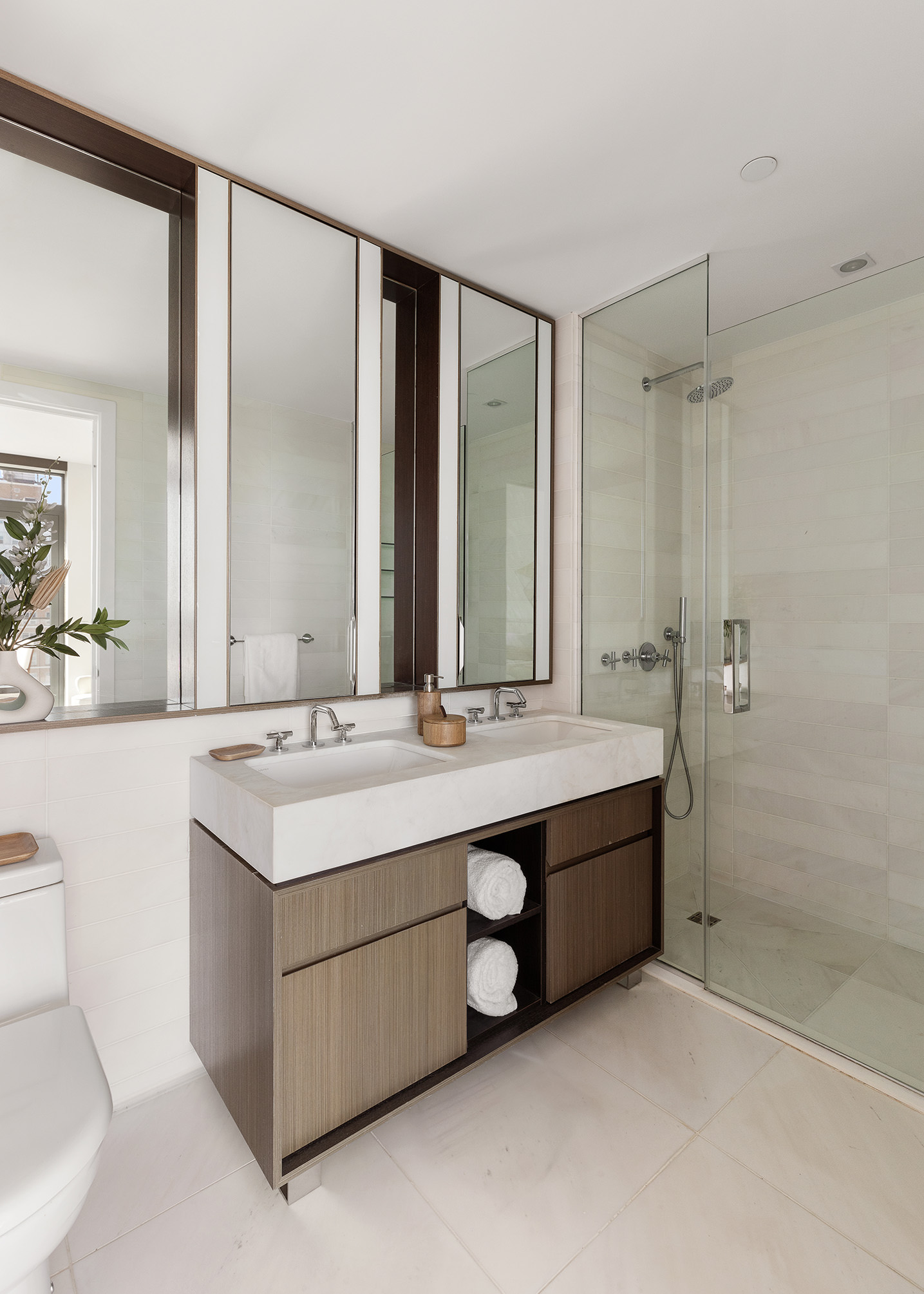 251 1st Street, Unit 7F Brooklyn, NY 11215 - Photo 13 of 24 a bathroom with a double vanity sink mirror double and shower
