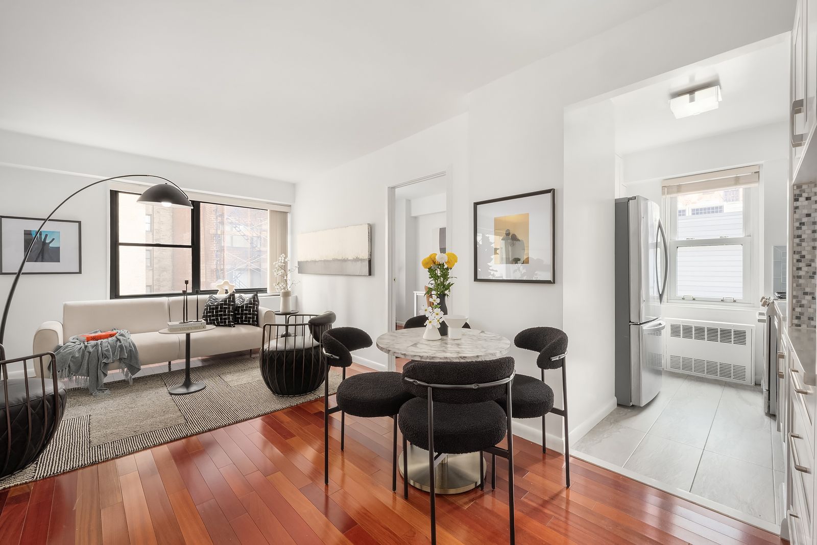 178 East 80th Street, Unit 7F Manhattan, NY 10075 - Photo 2 of 10 a living room with furniture and a large window