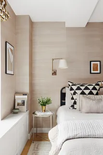 a bedroom with a bed and window