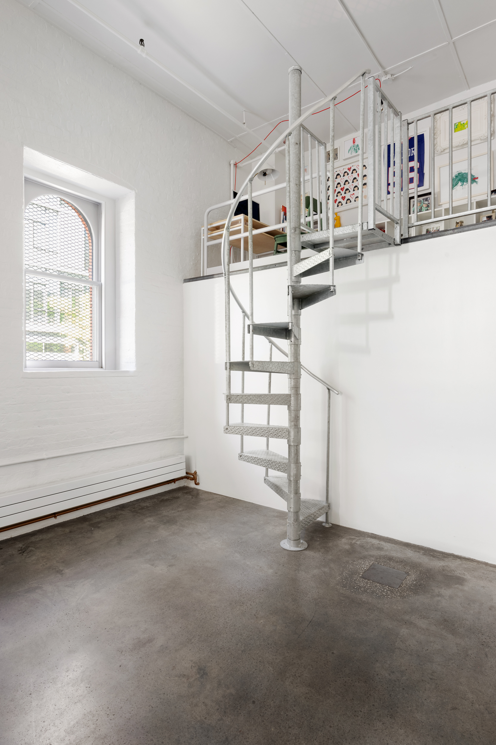 125 Watts Street, Unit 1 Manhattan, NY 10013 - Photo 14 of 24 an empty room with windows and pillars in it