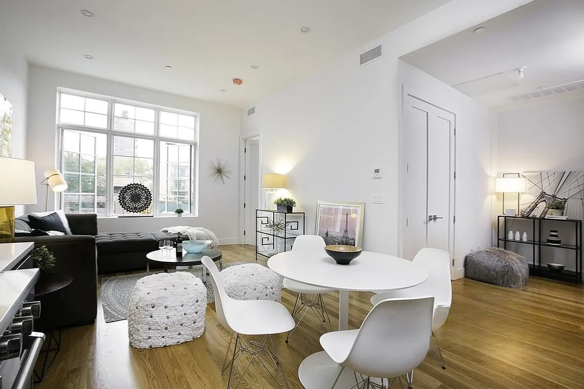 222 Withers Street, Unit 2A Brooklyn, NY 11211 - Photo 2 of 11 a living room with furniture and wooden floor