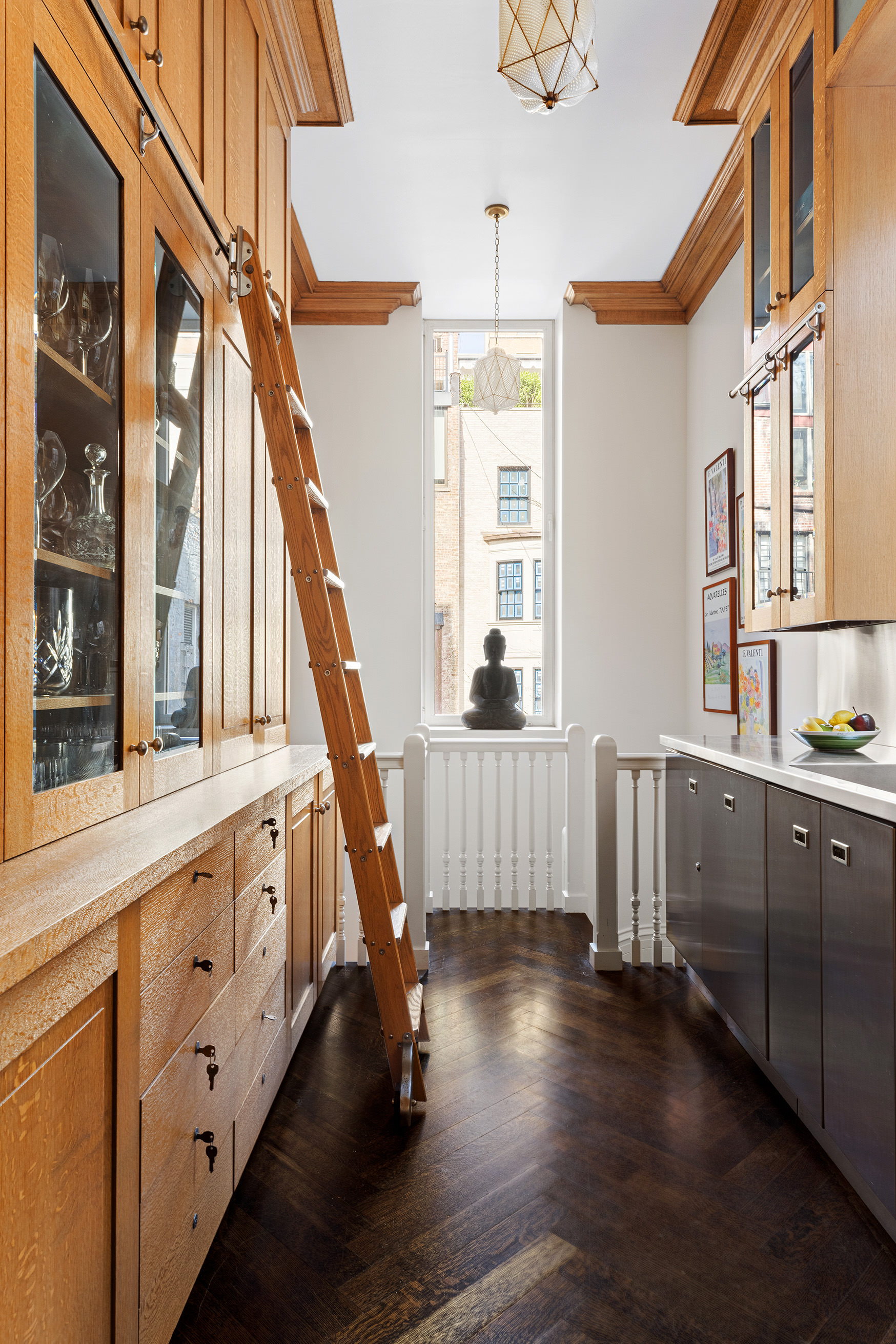 127 East 73rd Street Manhattan, NY 10021 - Photo 19 of 40 a view of an entryway with wooden floor and stairs