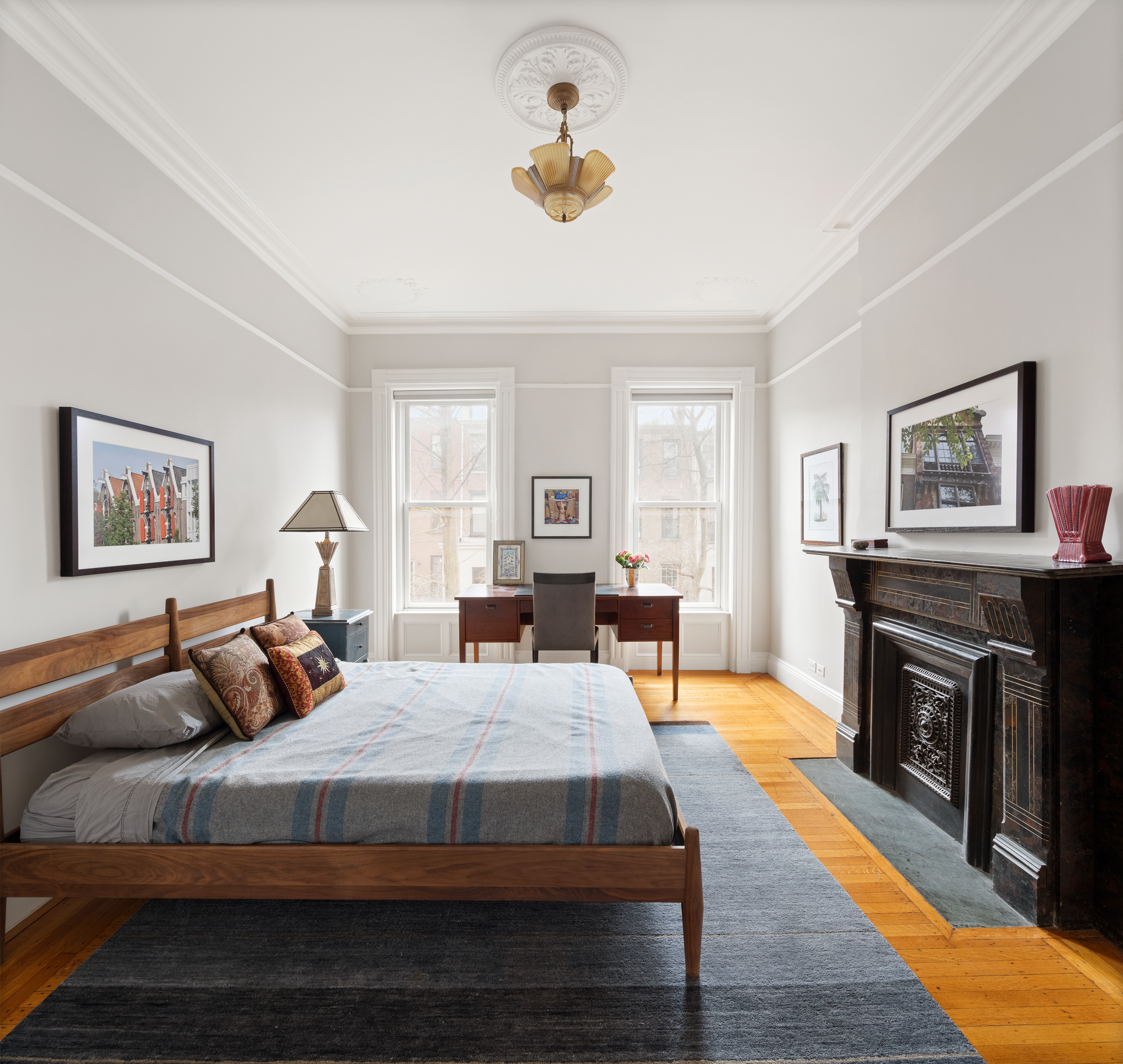 196 Berkeley Place Brooklyn, NY 11217 - Photo 14 of 25 a bedroom with a bed and wooden floor