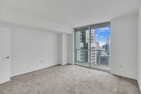 a view of an empty room with a sliding door