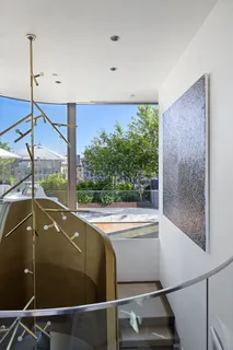 a view of a balcony with yard