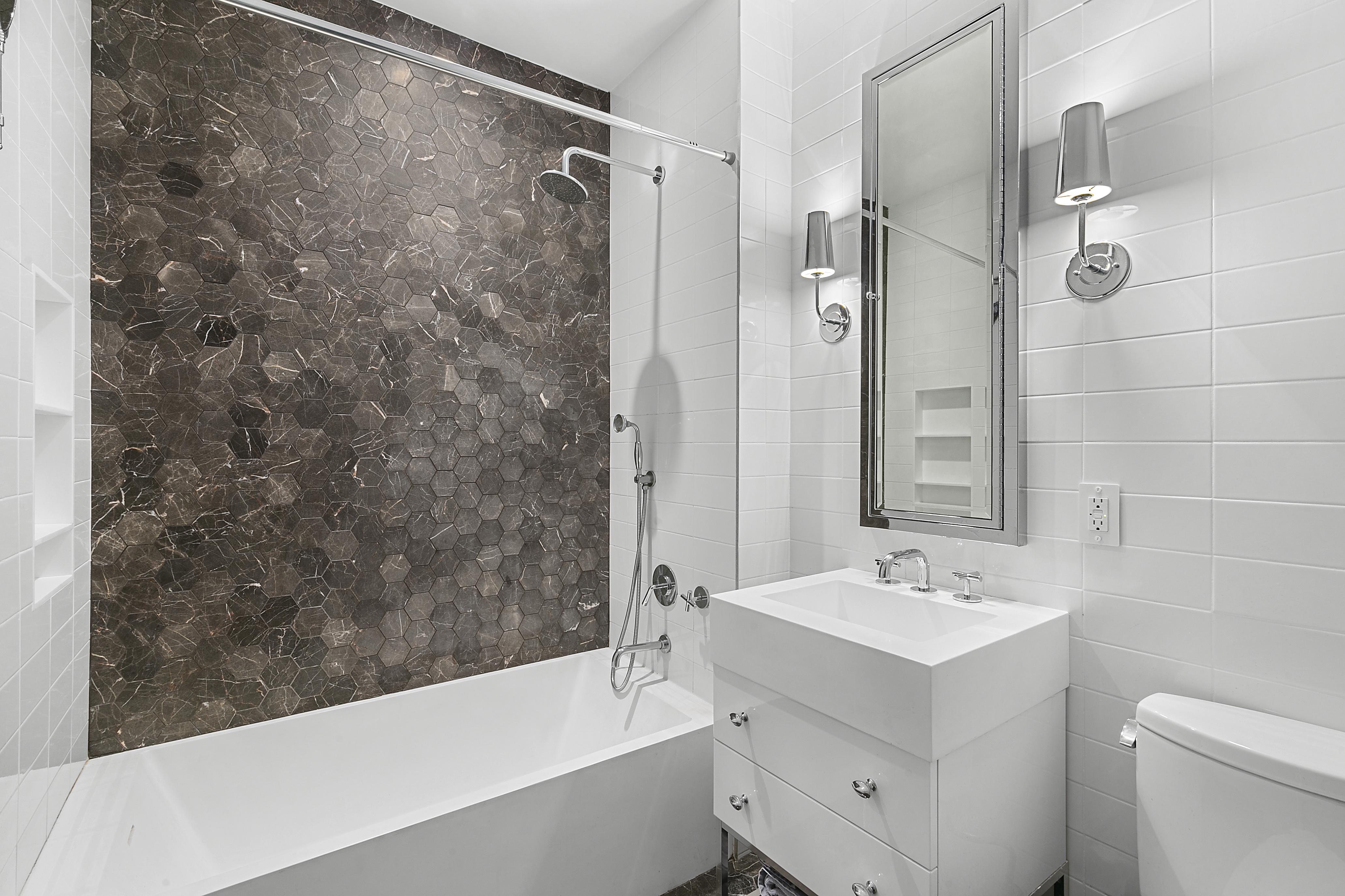 338 Berry Street, Unit 1B Brooklyn, NY 11249 - Photo 5 of 13 a bathroom with a sink mirror toilet and bathtub