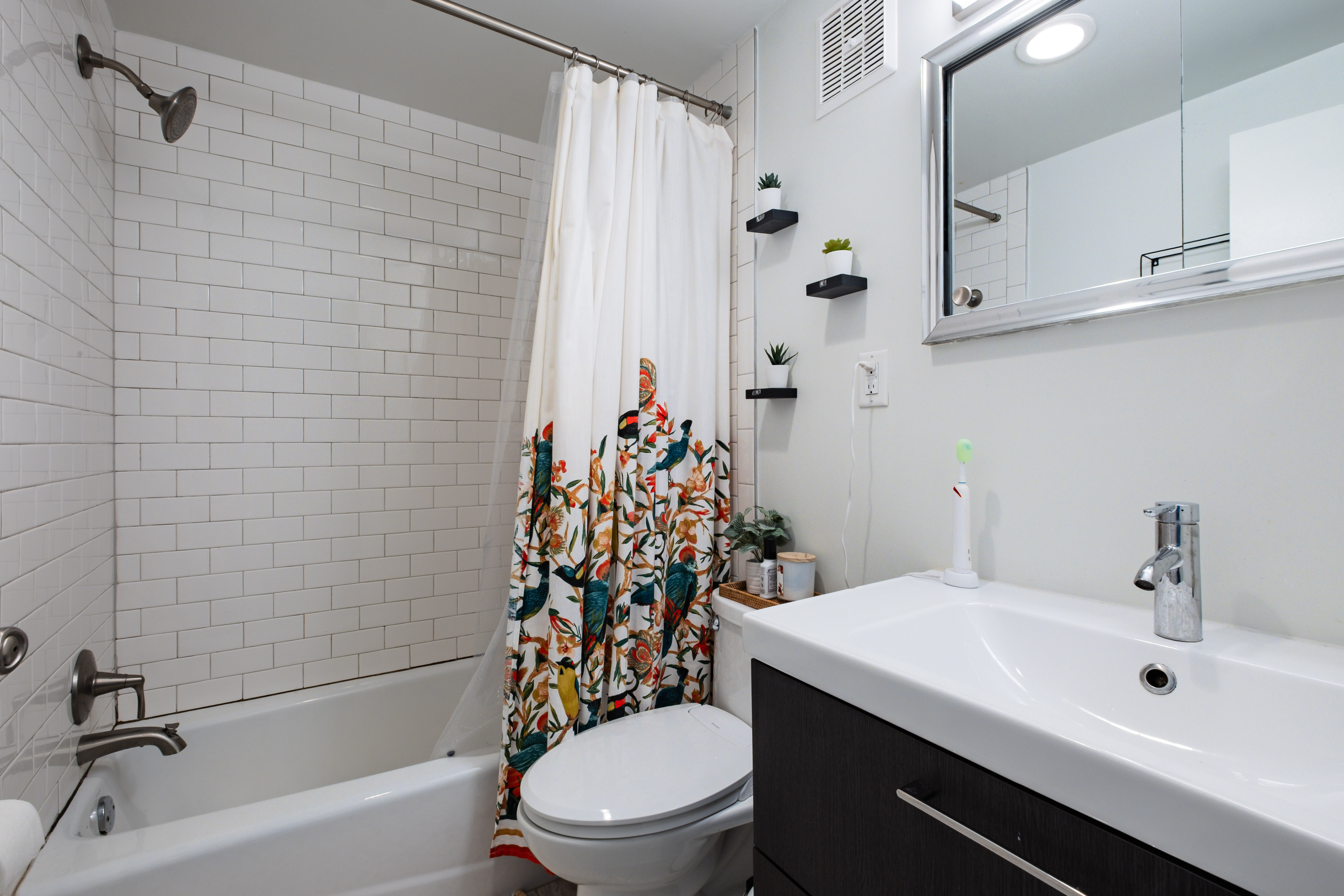 256 1/2 South 3rd Street Philadelphia, PA 19106 - Photo 63 of 73 a bathroom with a sink a toilet and shower curtain