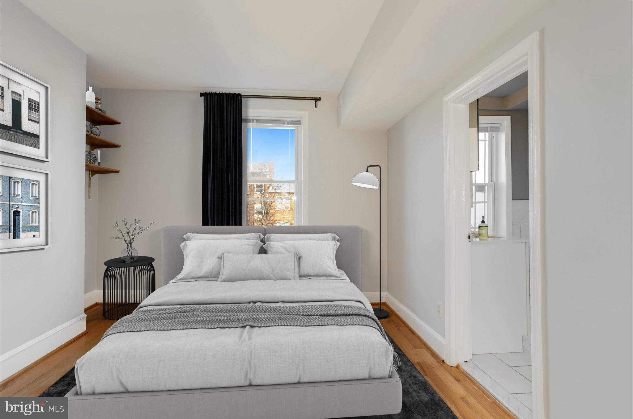 1317 Corcoran Street Northwest Washington, DC 20009 - Photo 36 of 47 a bedroom with a bed and a mirror