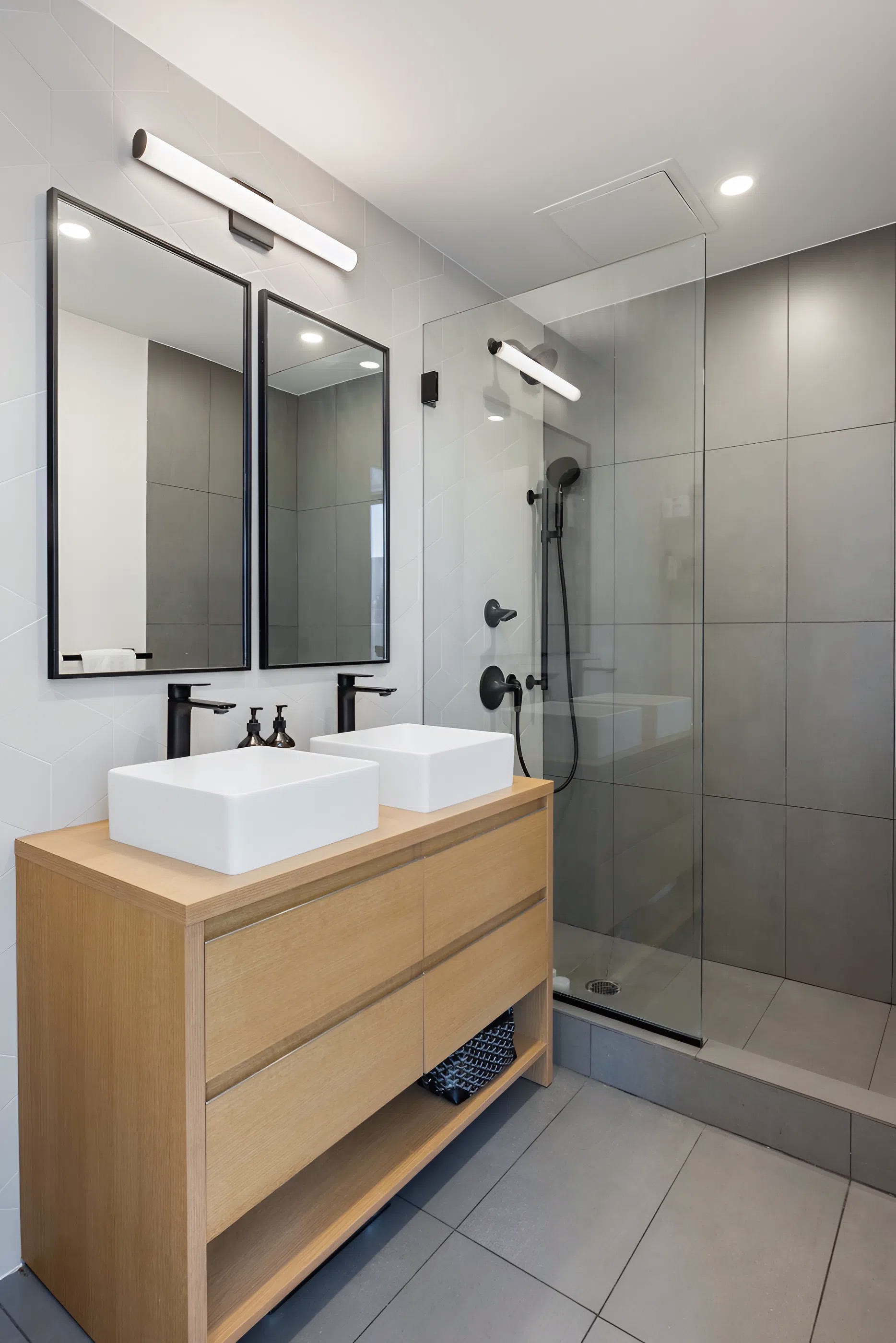 340 Metropolitan Avenue, Unit PHB Brooklyn, NY 11211 - Photo 9 of 18 a bathroom with a sink a shower and a mirror