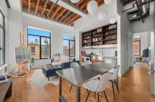 a view of a dining room with furniture and window