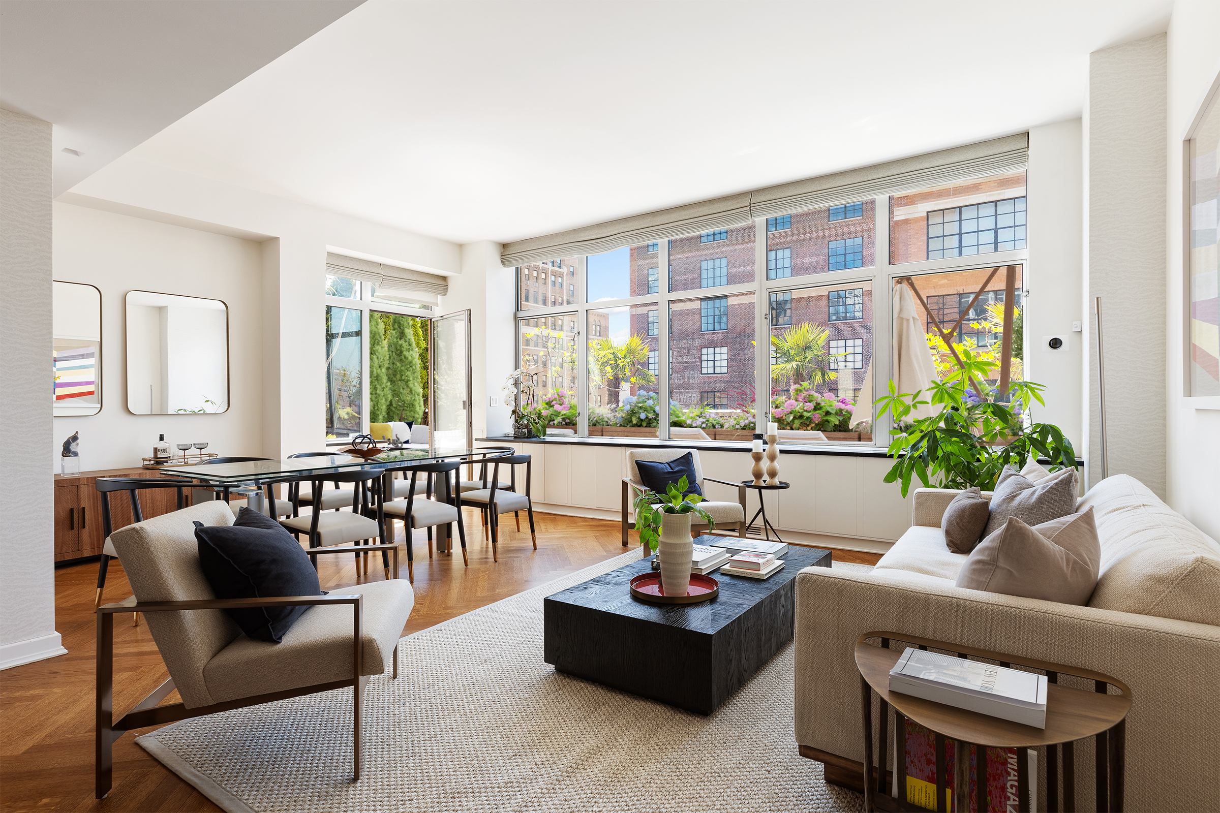 201 West 17th Street, Unit PHF Manhattan, NY 10011 - Photo 2 of 22 a living room with furniture and a large window