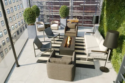 a view of backyard with seating space and plants