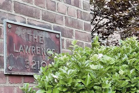 a sign that is on a brick building