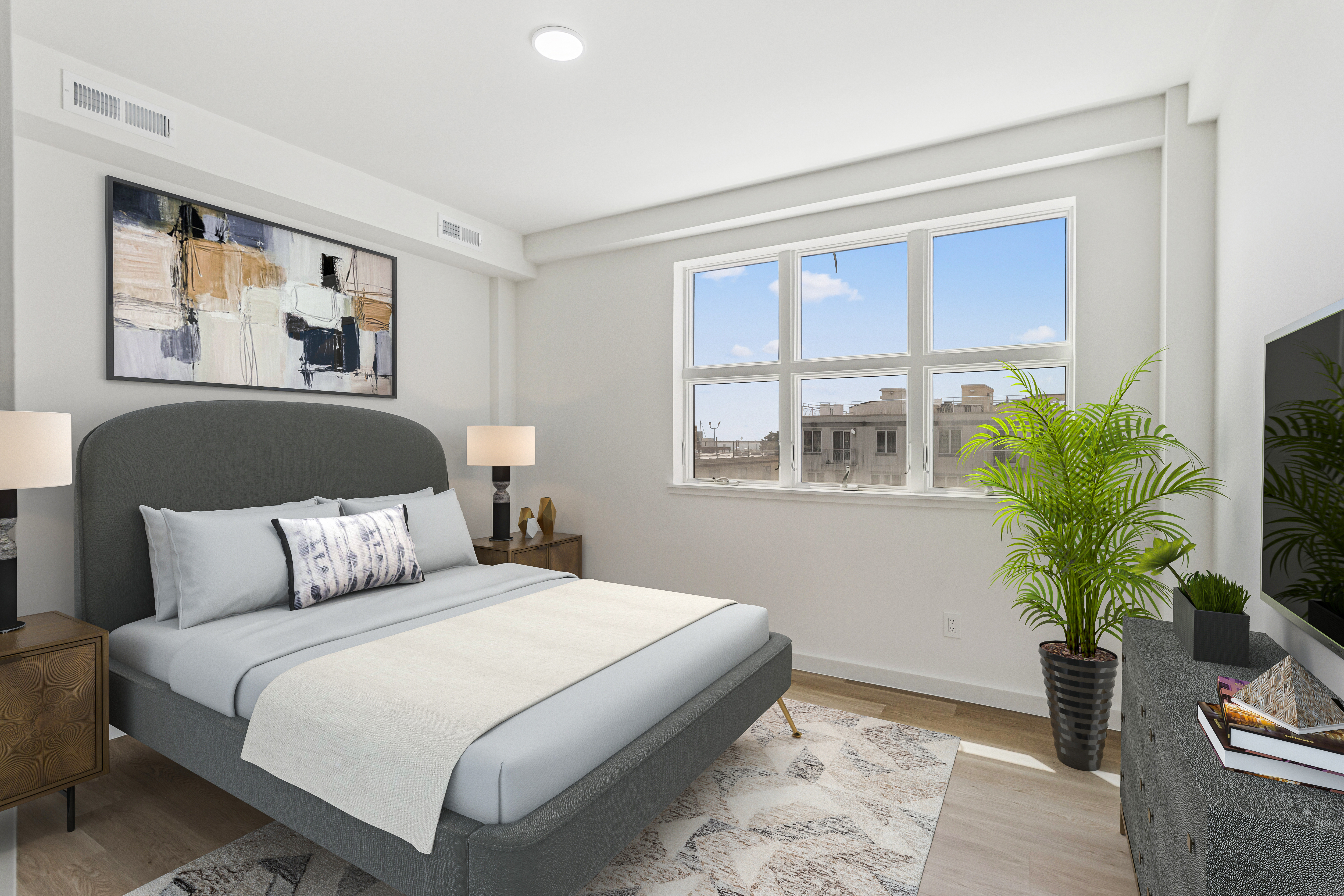 3112 Emmons Avenue, Unit 307 Brooklyn, NY 11235 - Photo 8 of 13 a bedroom with a large bed and a potted plant