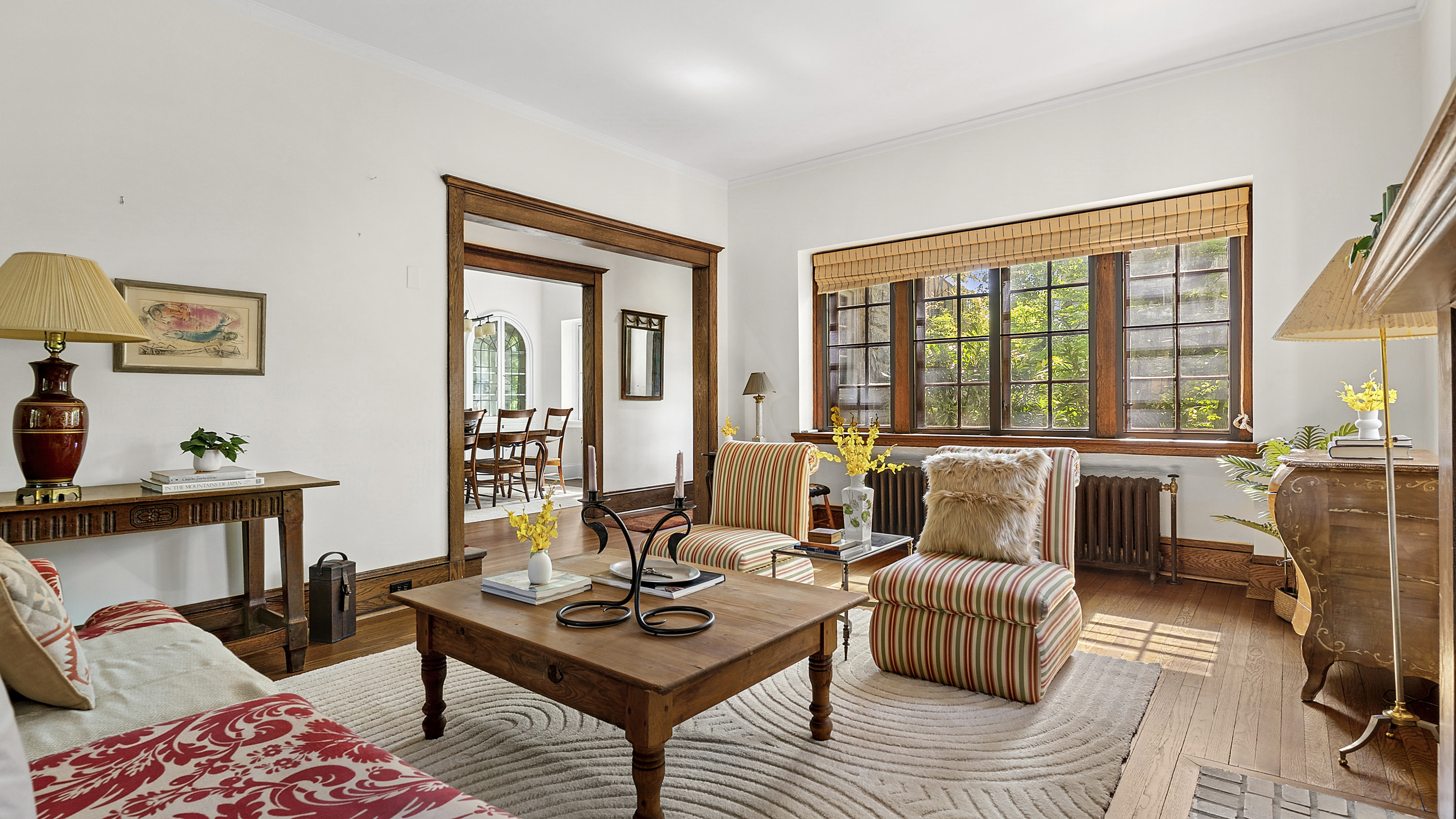 4417 Tibbett Avenue Bronx, NY 10471 - Photo 4 of 20 a living room with furniture and a floor to ceiling window
