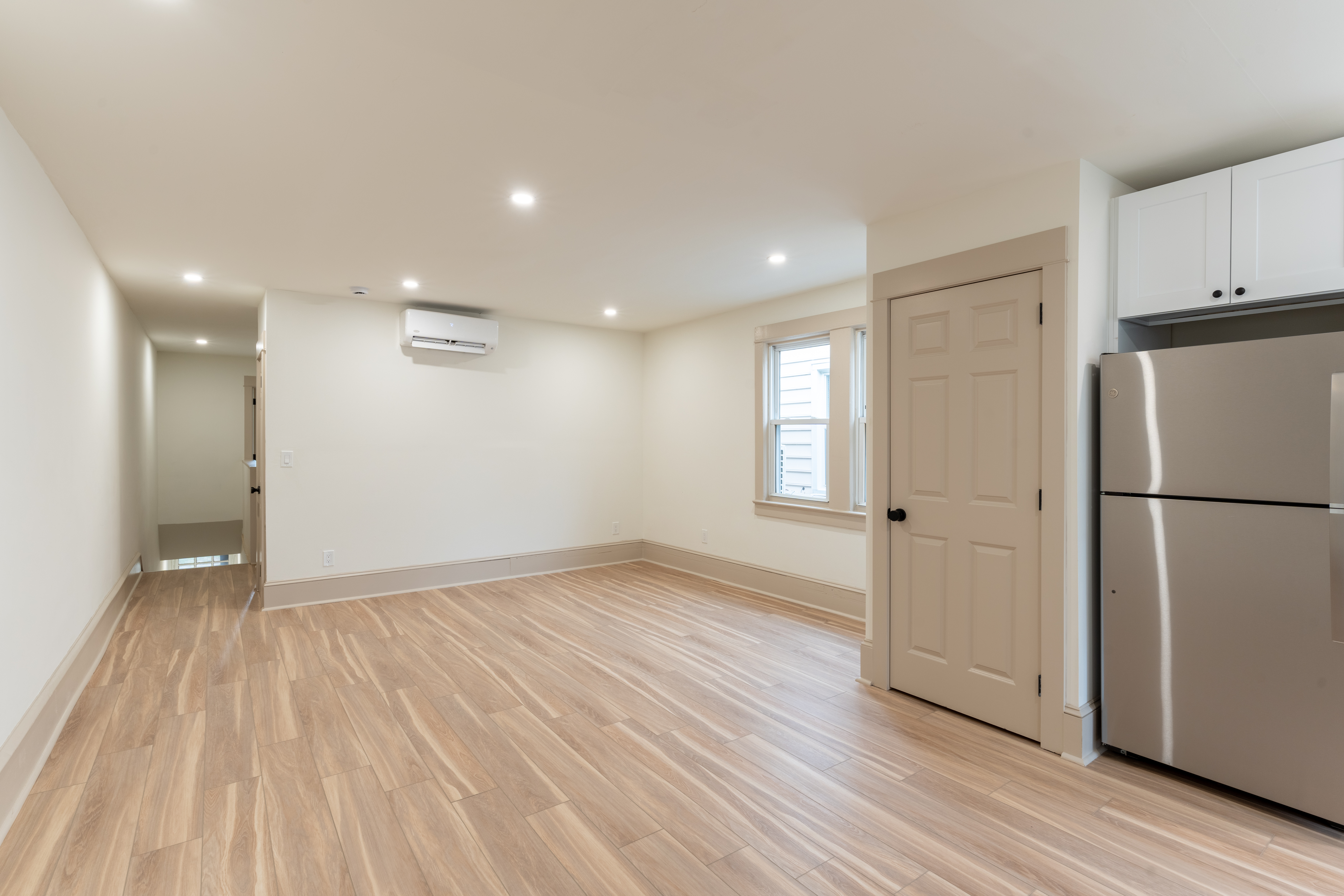 423 North Haddon Avenue Haddonfield, NJ 08033 - Photo 6 of 16 a view of empty room with wooden floor and window