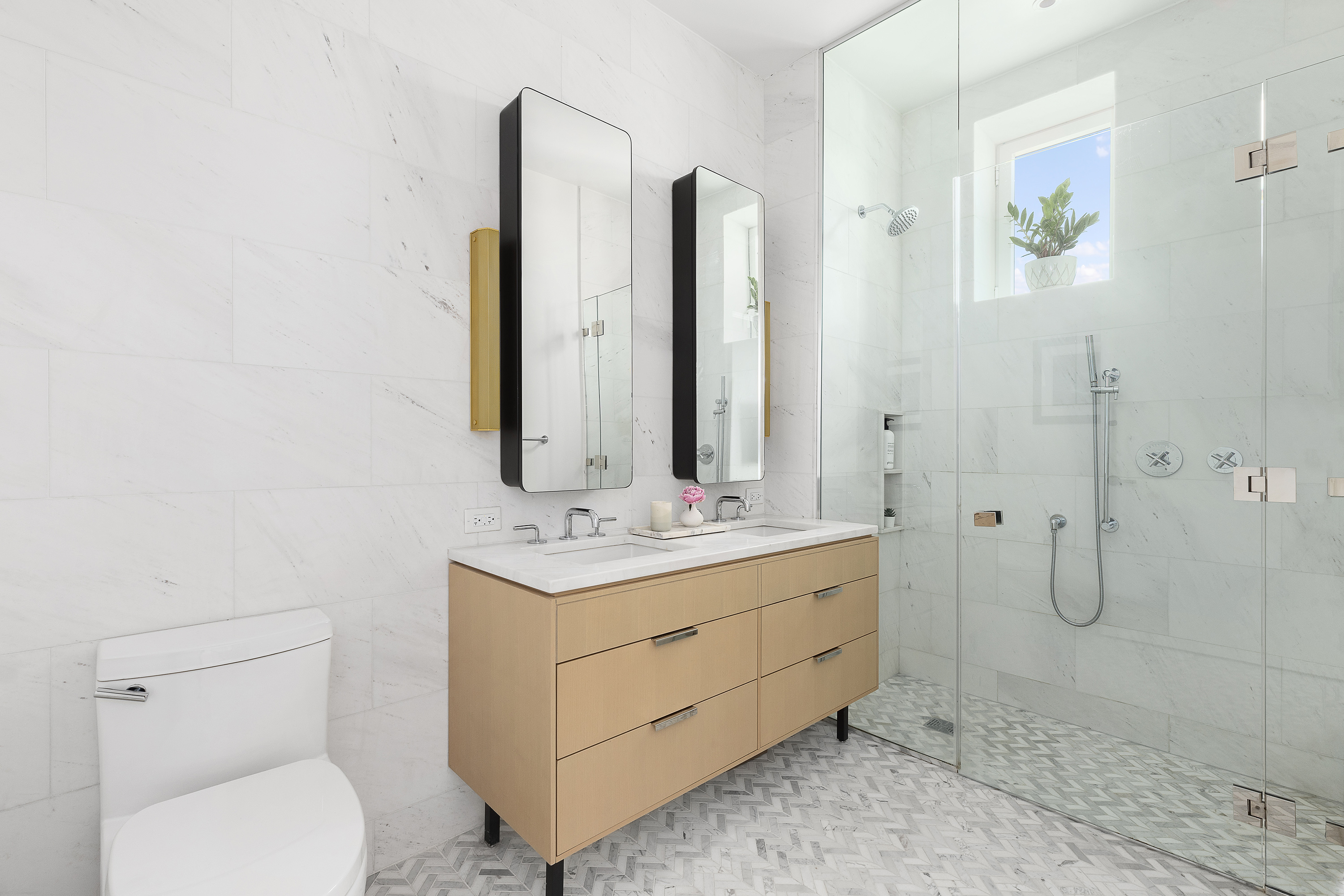 181 18th Street, Unit 1002 Brooklyn, NY 11215 - Photo 11 of 19 a bathroom with a granite countertop toilet sink and mirror