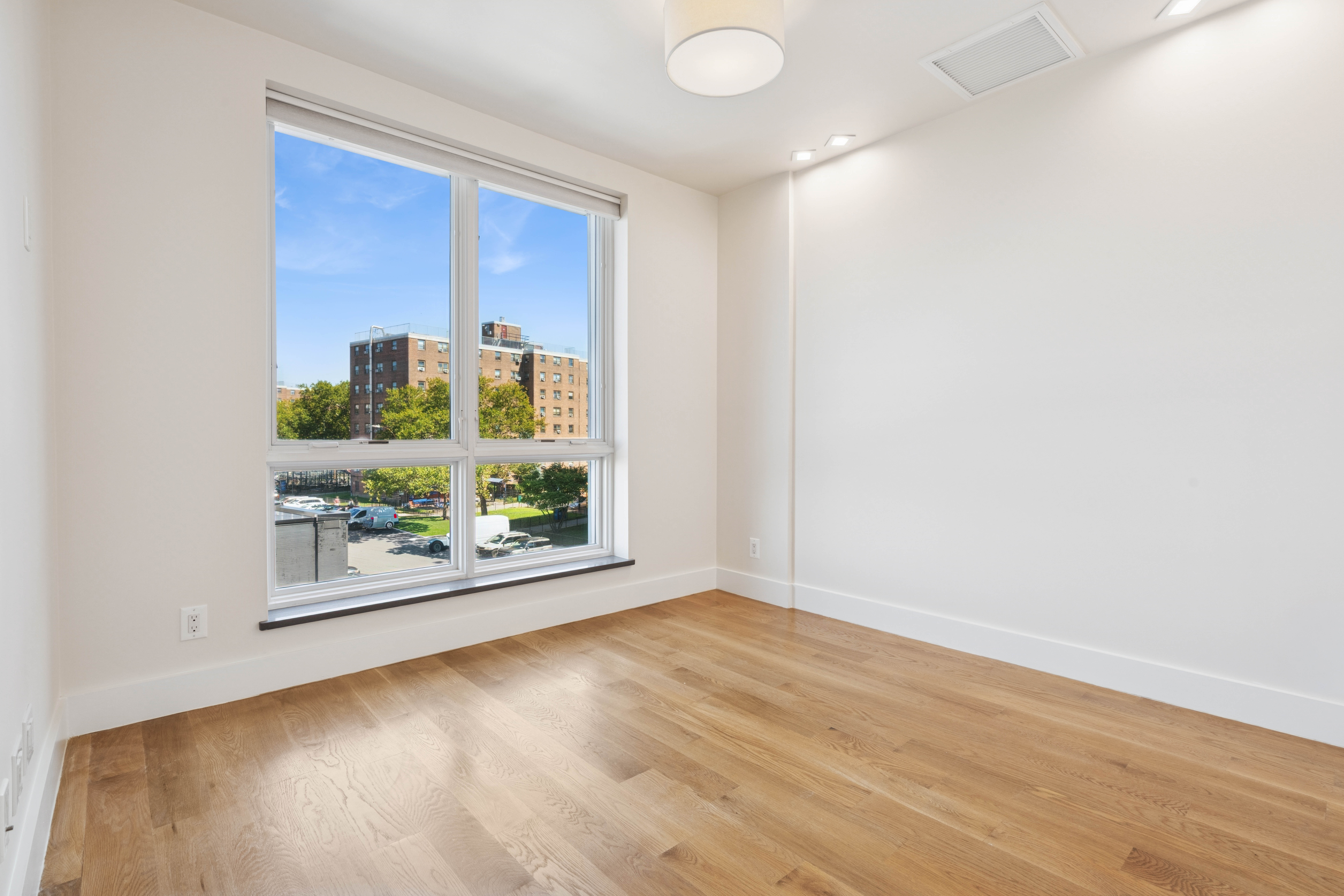 77 Kingsland Avenue, Unit 4F Brooklyn, NY 11211 - Photo 9 of 14 a view of an empty room with a window