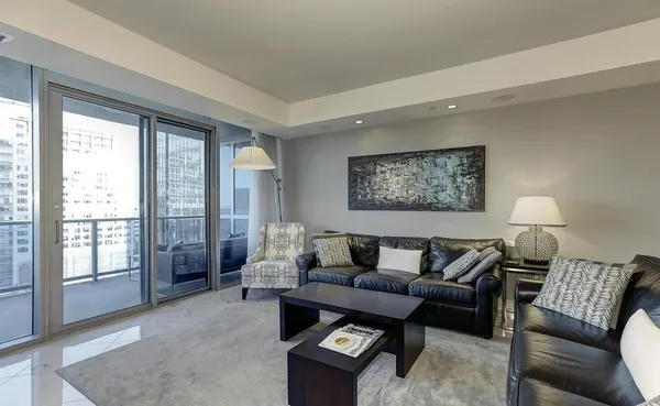 a living room with furniture and a large window